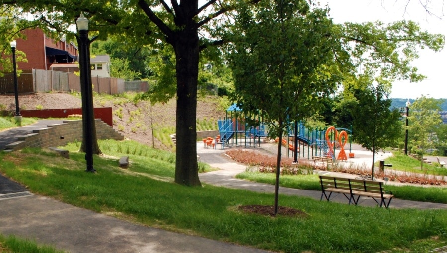 August Wilson Park playground among greenery and trees