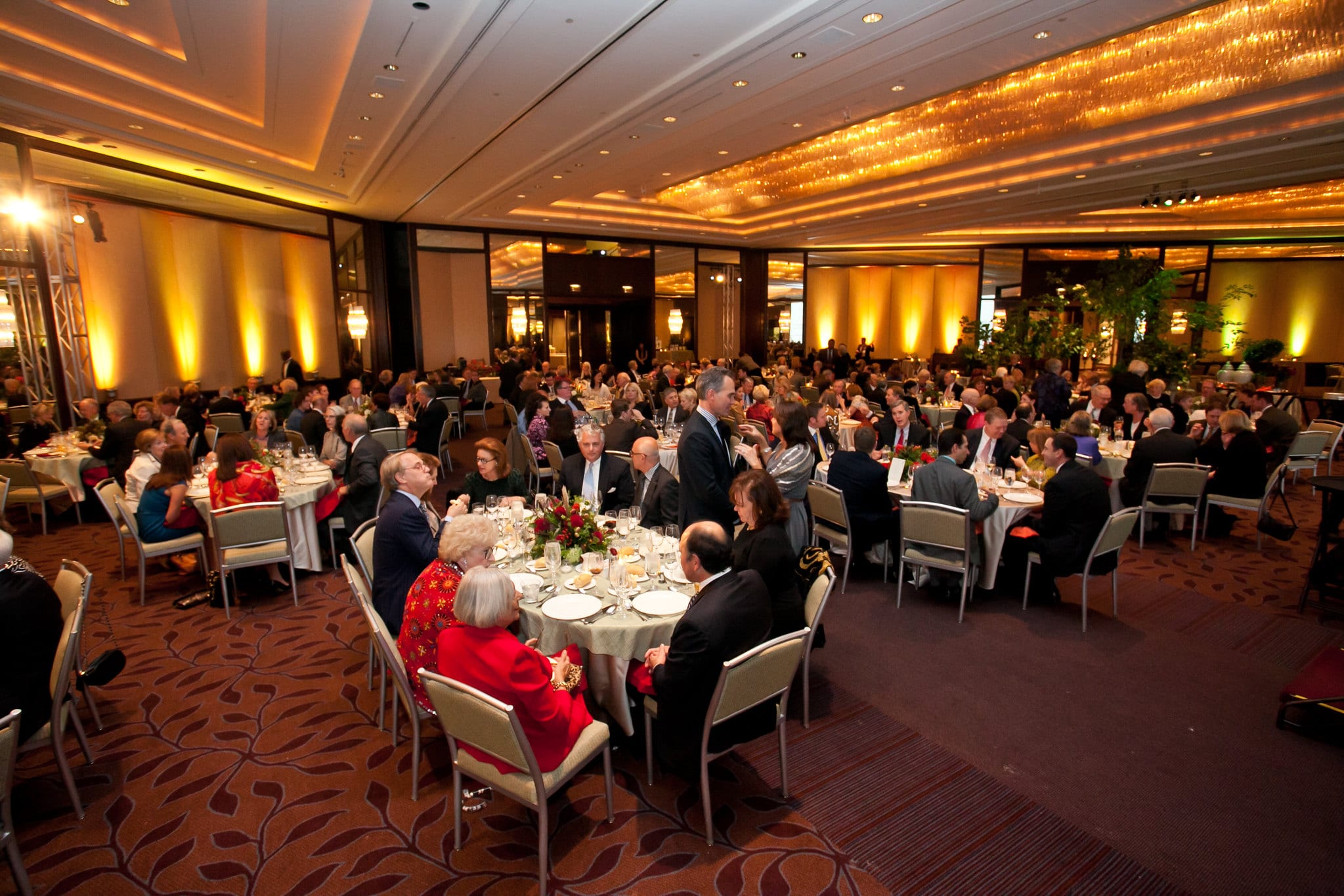 People seated at tables at a formal event