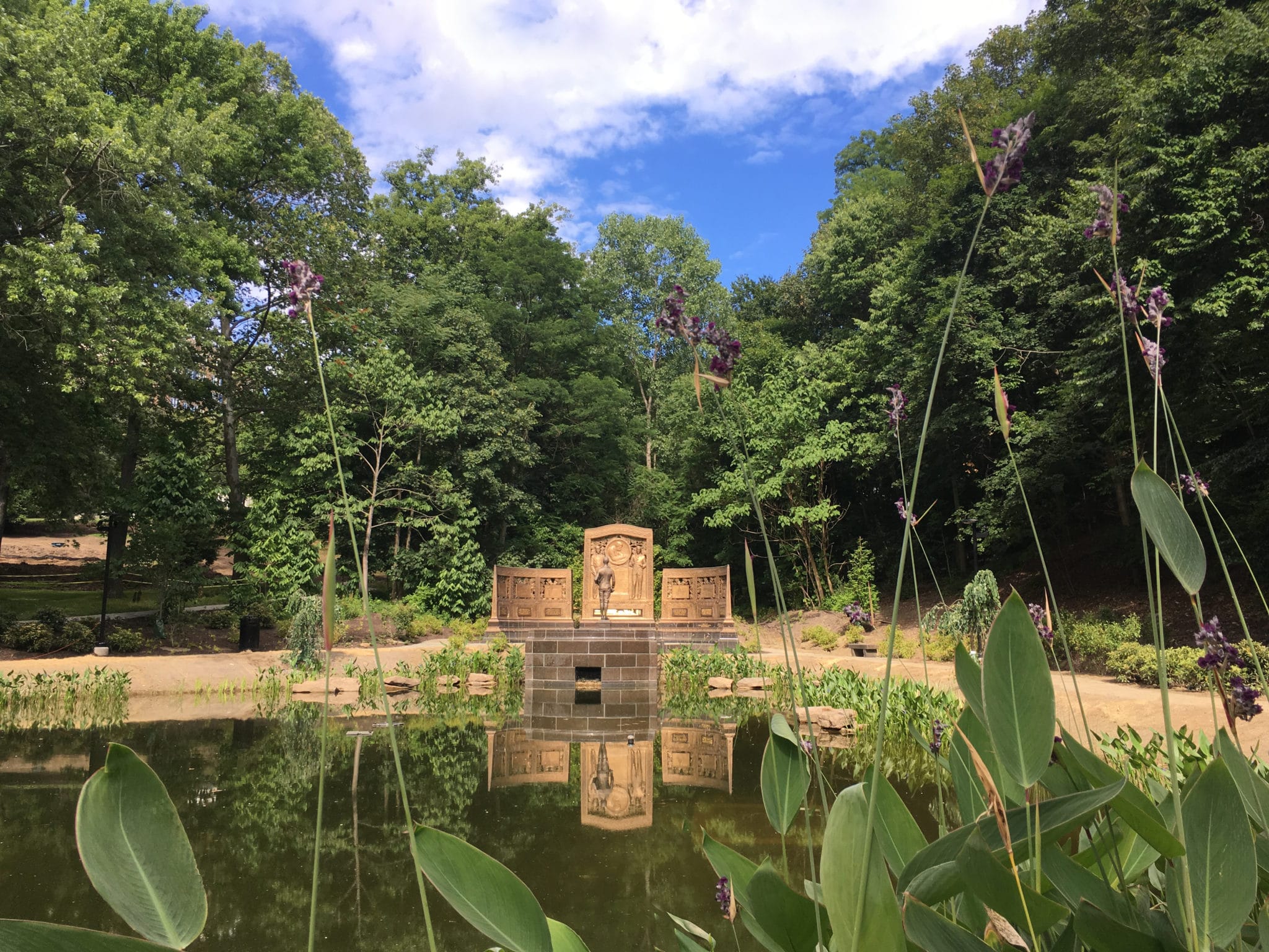 Westinghouse Memorial reflecting pond statue flowers blue sky
