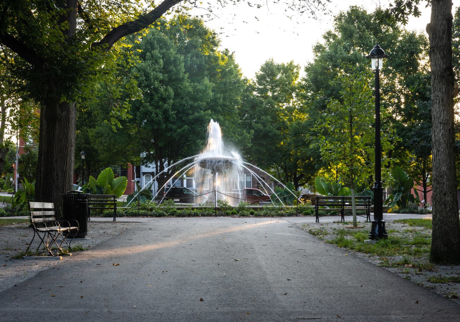 An image of a fountain in Allegheny Commons Park from a trail