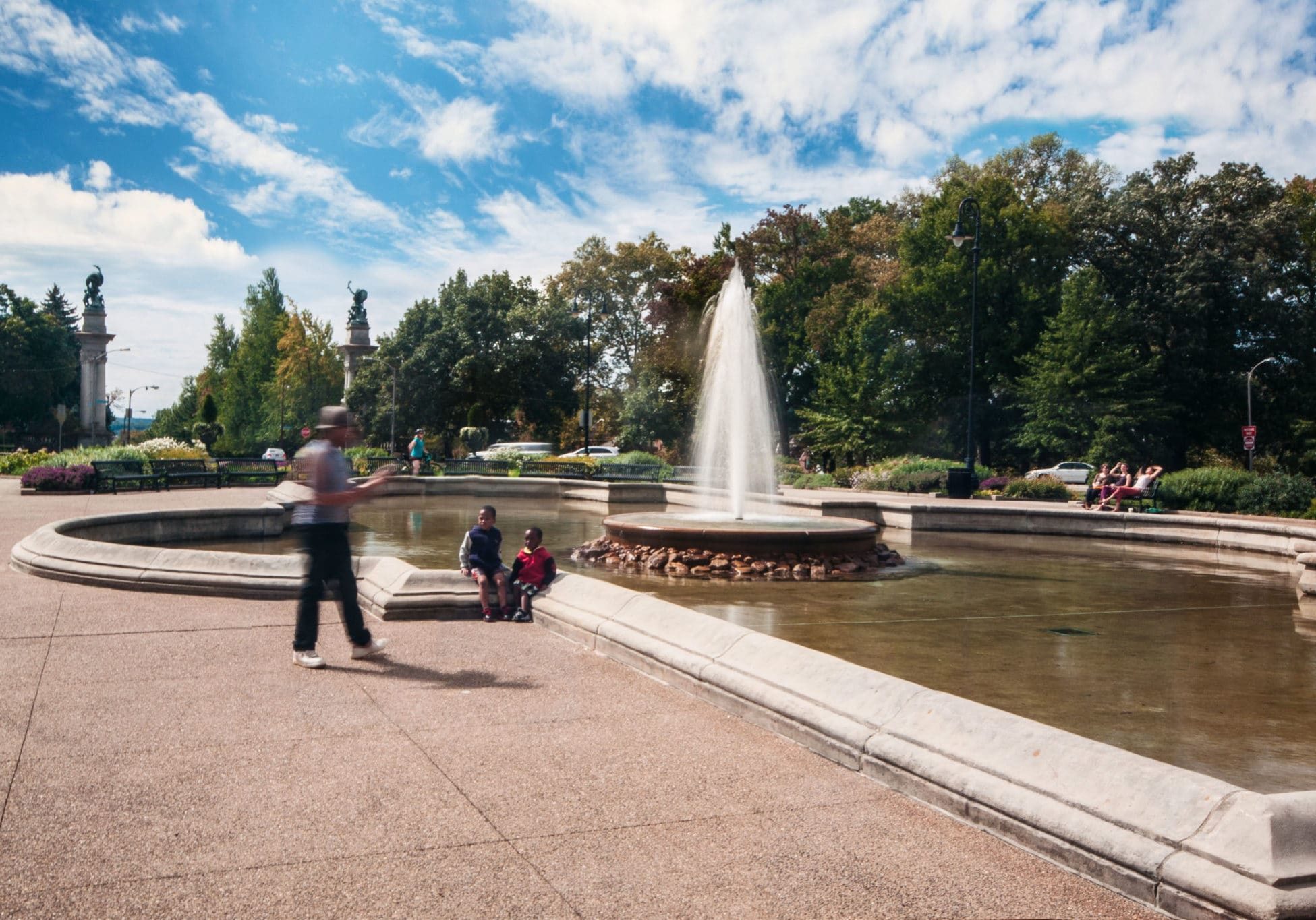 Children sitting by Highland Park fountain